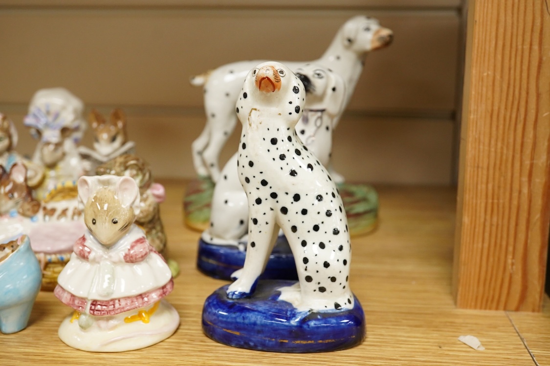A collection of Beatrix Potter figures, three Staffordshire Dalmatians and a Copenhagen Dalmatian, tallest 16cm high